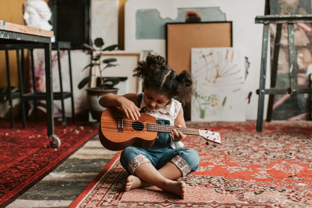 Young Girl Playing Music on Ukulele